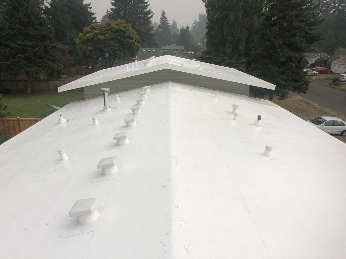 Finished single-ply membrane low-slope roof on a home in the Greater Eastside, WA