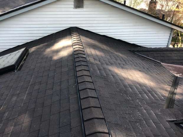 Shingle roof with continuous ridge vent on a home in the Greater Eastside, WA