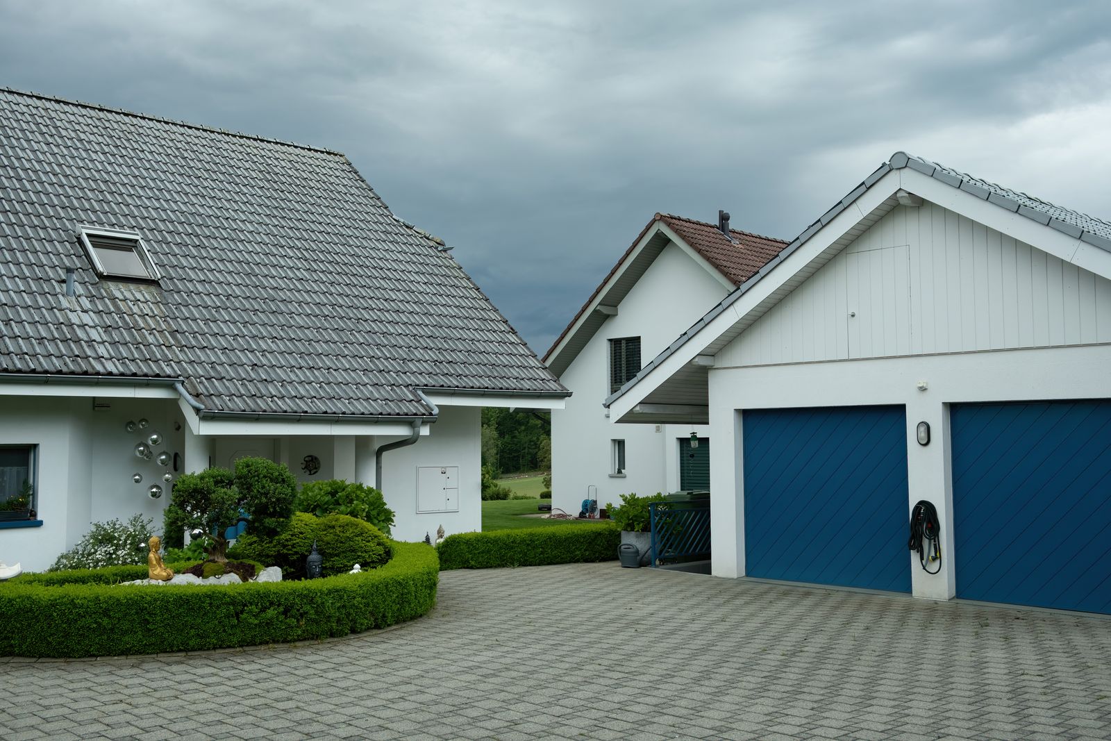 Homes with grey concrete tile roofs