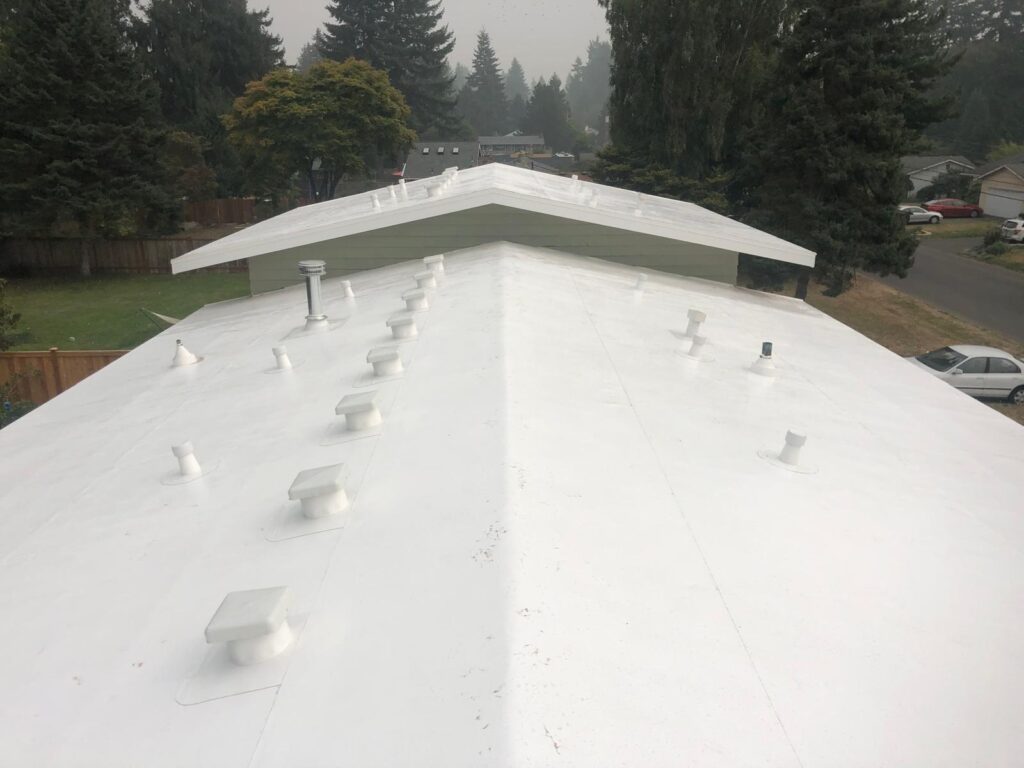 Finished white PVC single-ply membrane roof on a home in the Greater Eastside, WA