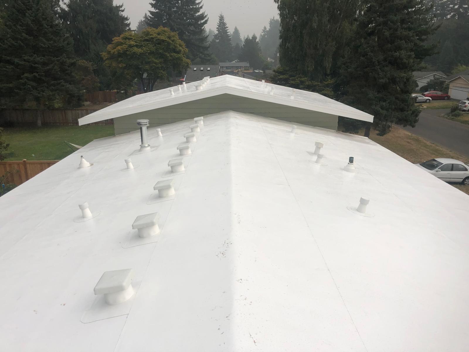 Finished white PVC single-ply membrane roof on a home in the Greater Eastside, WA